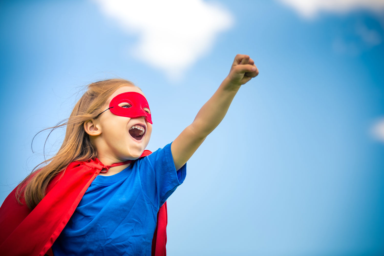 girl dressed up as superhero